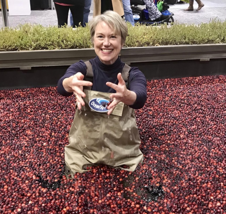 Jennifer Stack smiling in a cranberry bog